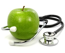 Green apple with a stethoscope.